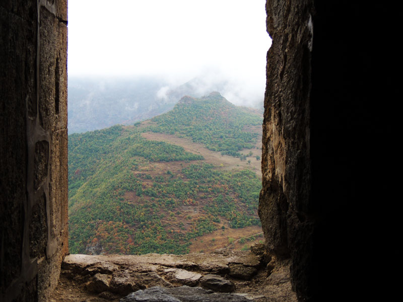 Вид через окно одного из помещений монастыря. Вид через окно одного из помещений монастыря.
